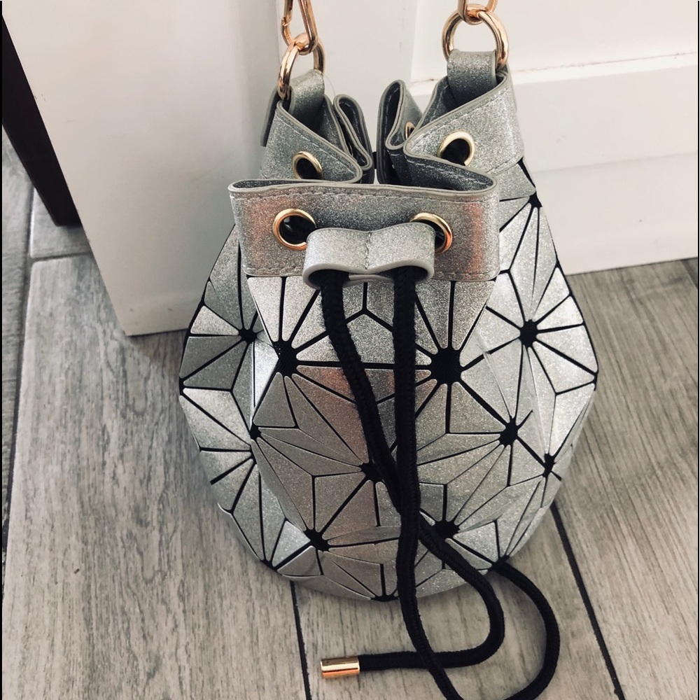 Symetrical silver and black bucket purse